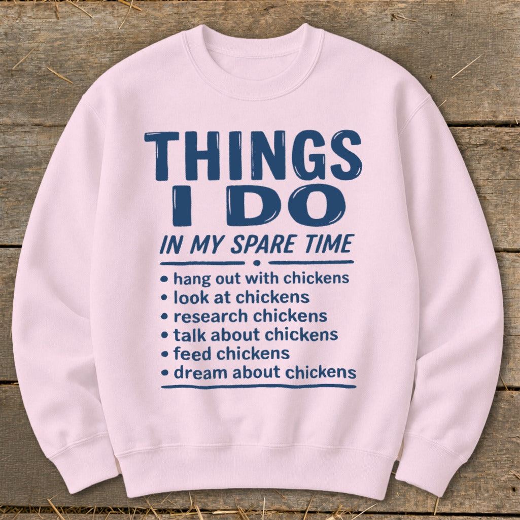 Pink sweatshirt with "Things I Do In My Spare Time" text about chickens.