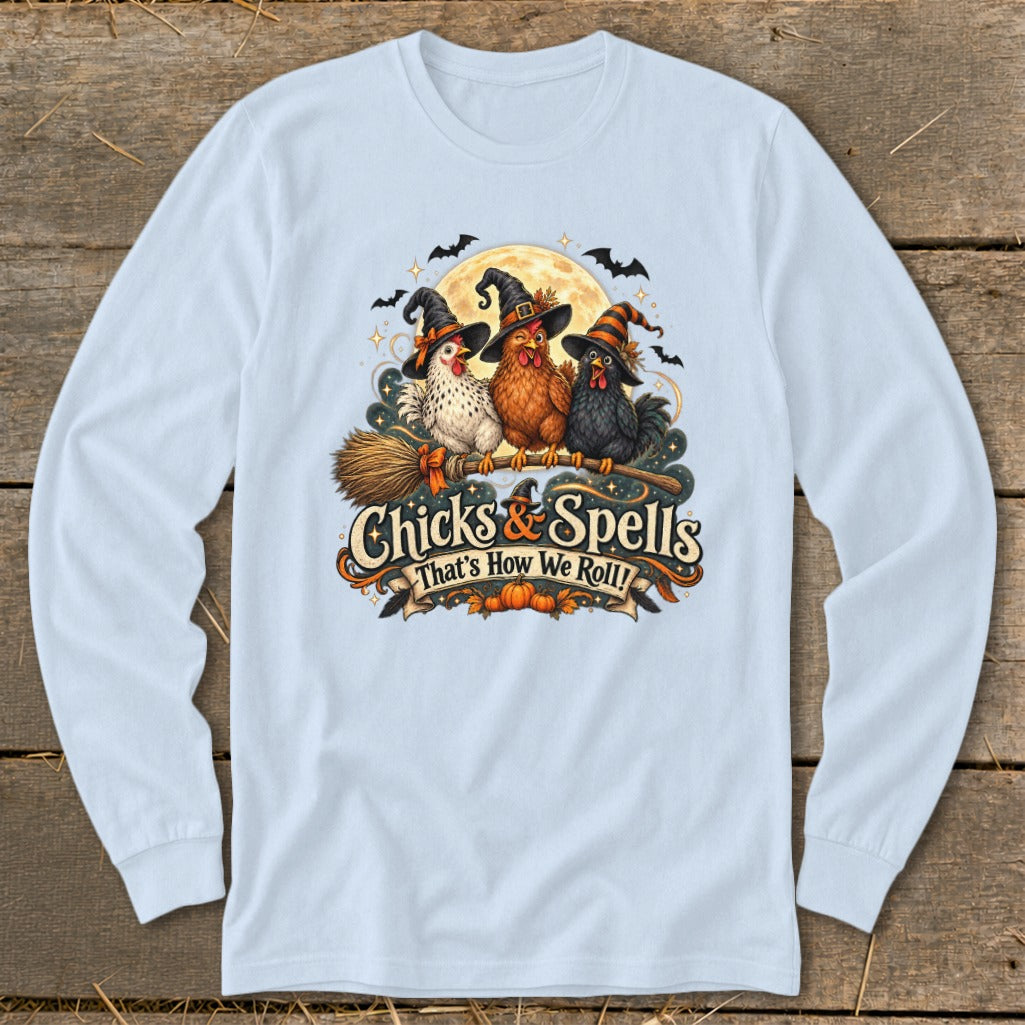 Three chickens in witch hats on a broomstick with text "Chicks & Spells That's How We Roll!".