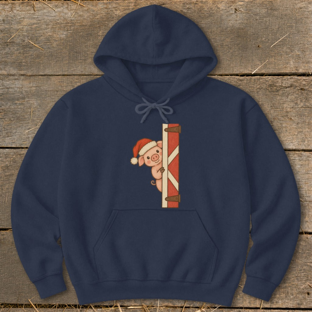 Navy blue hoodie with a pig wearing a Santa hat peeking from behind a barn door graphic.