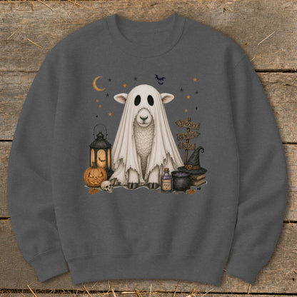 Sheep dressed as a ghost with Halloween decorations and "Spooky Beware Boo!" sign.
