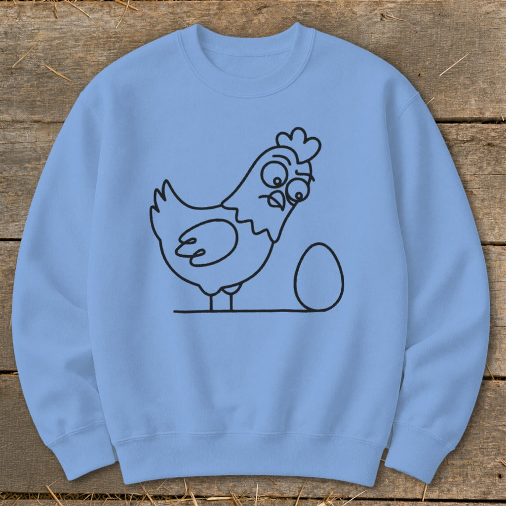 Light blue sweatshirt with a black outline drawing of a surprised chicken next to an egg.