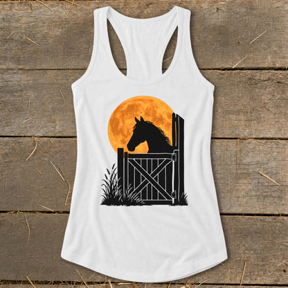 White racerback tank top featuring a graphic of a horse silhouette looking over a stall gate against a large orange moon.