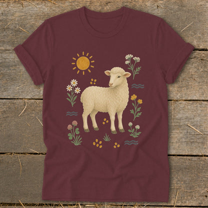 Maroon t-shirt with a cream sheep surrounded by flowers and a sun.