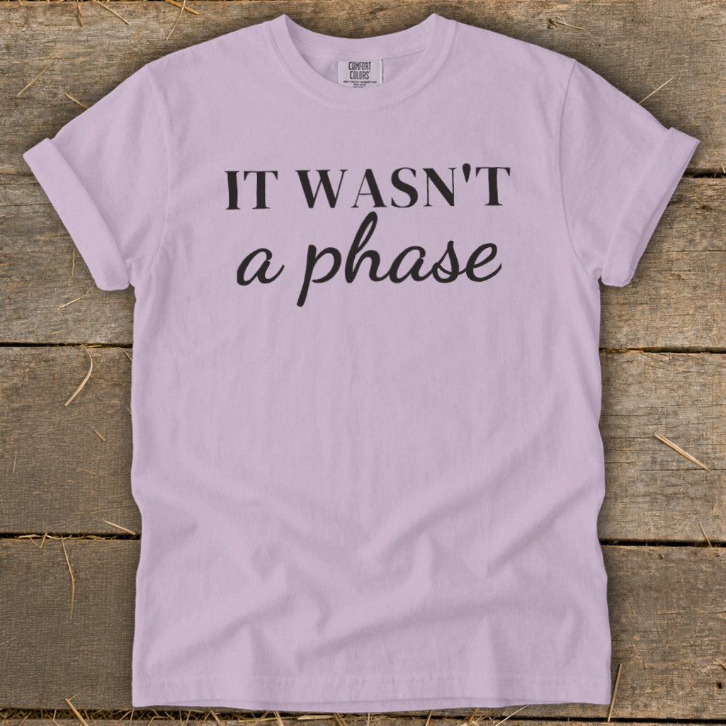 Lavender t-shirt with black text reading "IT WASN'T a phase".