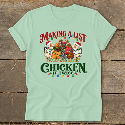 Christmas chickens in Santa hats and scarves with lights and text "Making a list, chicken it twice."