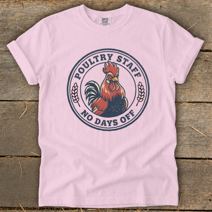 Pink t-shirt with circular graphic of a rooster and text "POULTRY STAFF NO DAYS OFF".