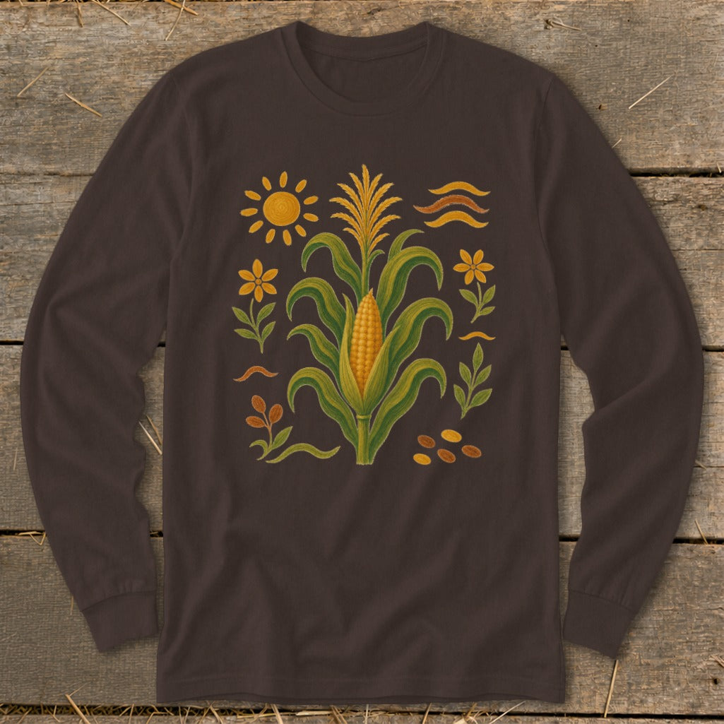 Long-sleeve shirt with folk art corn, sun, flowers, and leaves design.