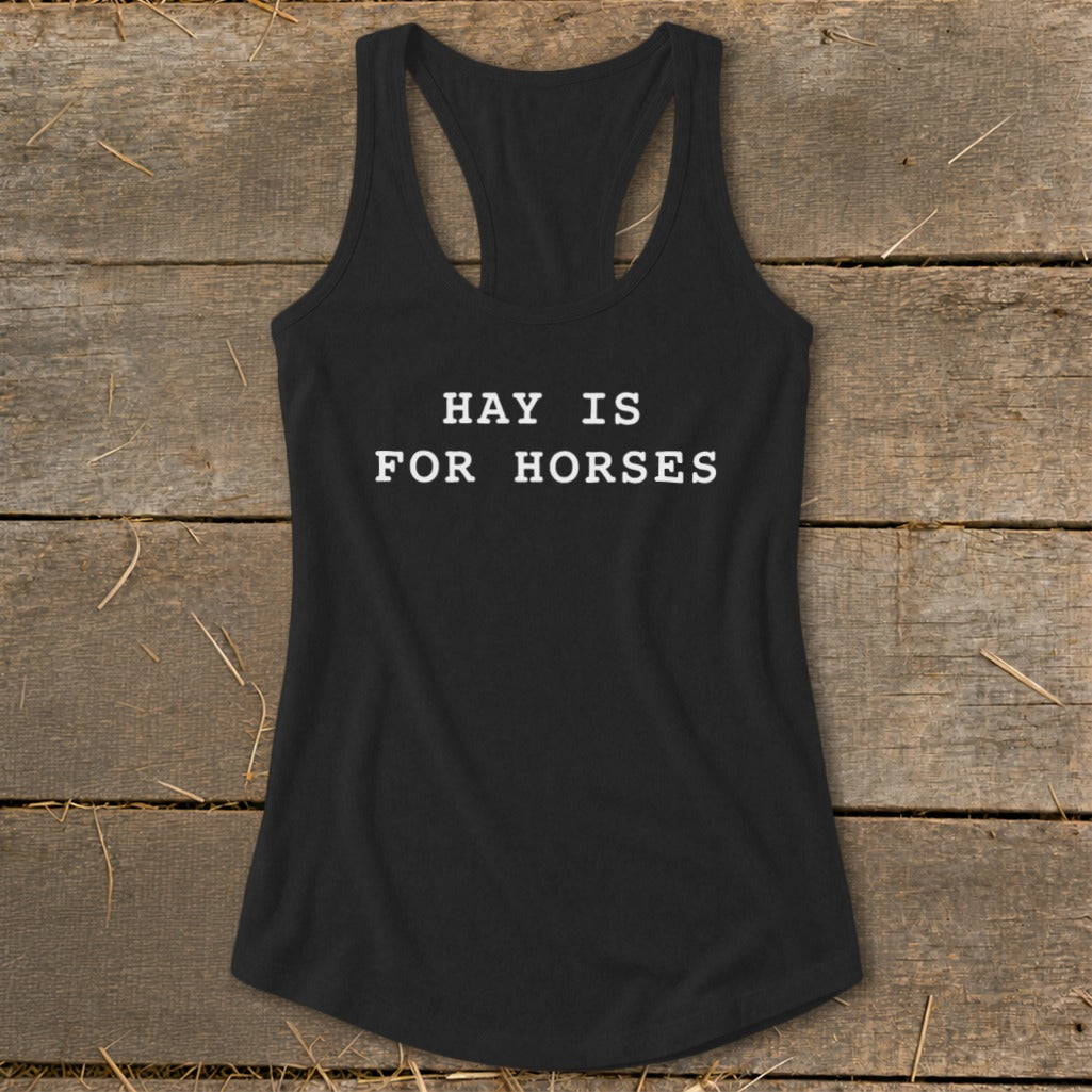 Black racerback tank top with white text that reads "HAY IS FOR HORSES".