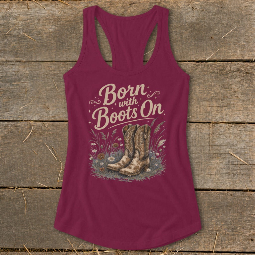 Maroon tank top with "Born with Boots On" graphic featuring cowboy boots in grass.