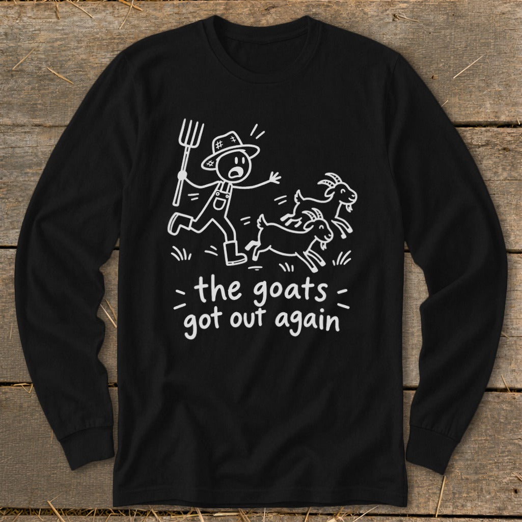 Black long-sleeve shirt with white cartoon of farmer chasing goats and text "the goats got out again".