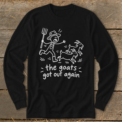 Black long-sleeve shirt with white cartoon of farmer chasing goats and text "the goats got out again".