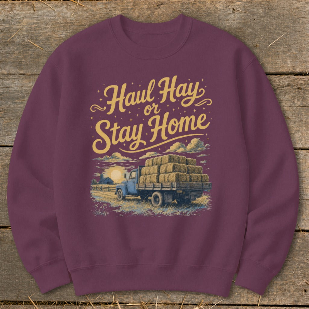 Sweatshirt with "Haul Hay or Stay Home" text and a truck loaded with hay bales.