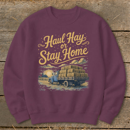 Sweatshirt with "Haul Hay or Stay Home" text and a truck loaded with hay bales.