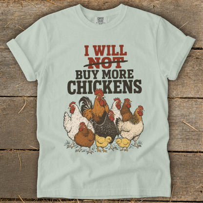 Light blue t-shirt with "I Will Not Buy More Chickens" and a group of chickens.