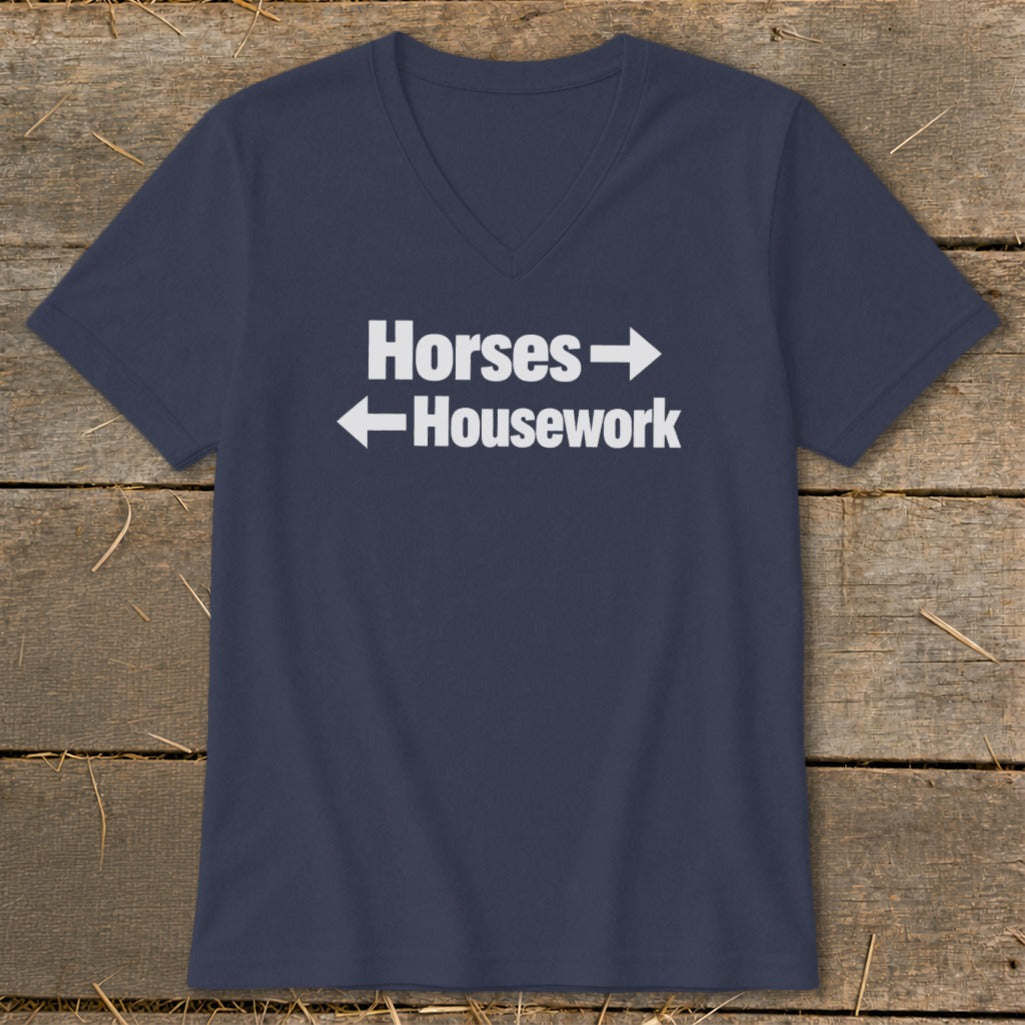 Navy blue V-neck t-shirt with white text reading "Horses" and "Housework" pointing in opposite directions.