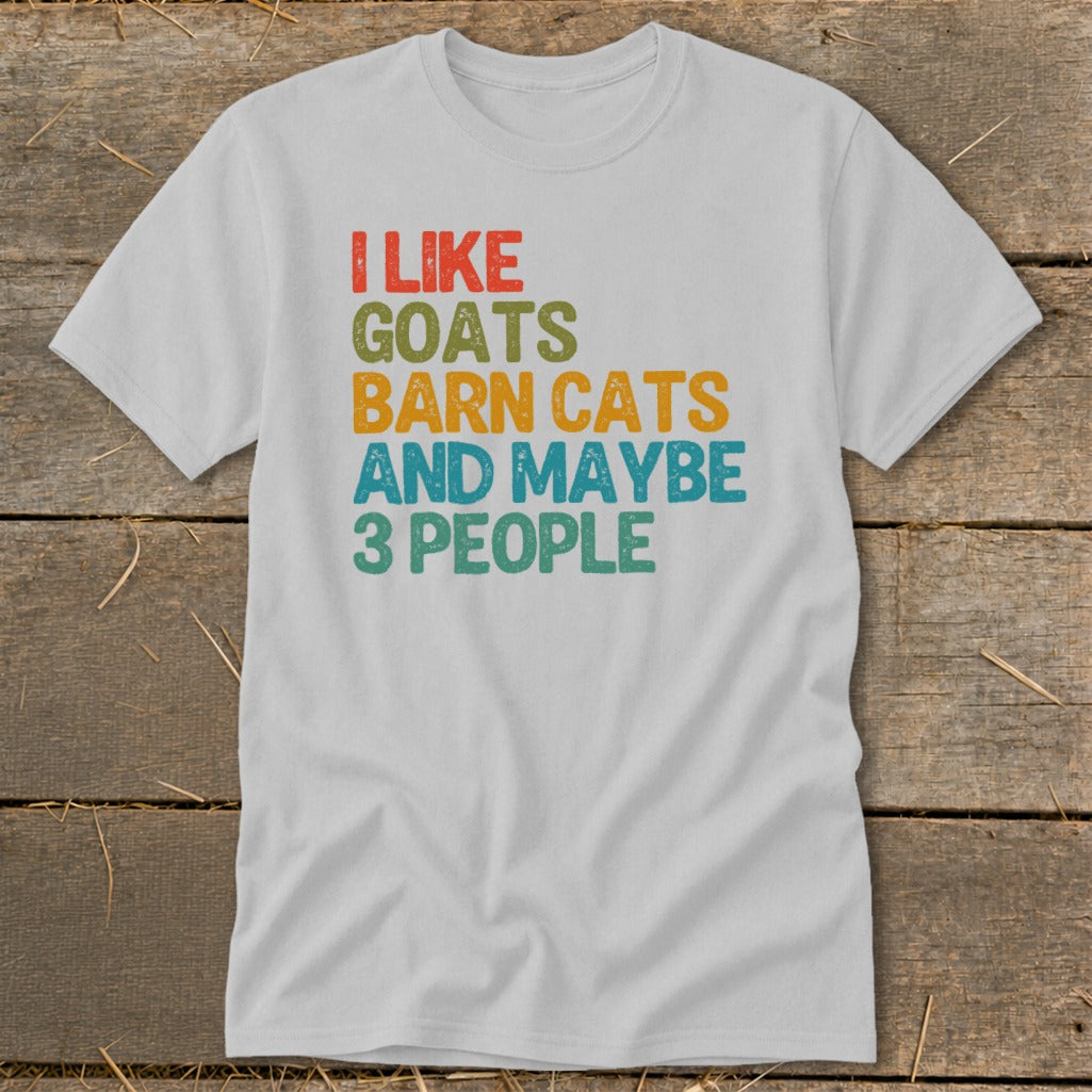 White t-shirt with "I like goats, barn cats, and maybe 3 people" text.