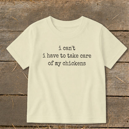 Cream t-shirt with "i can't i have to take care of my chickens" text.