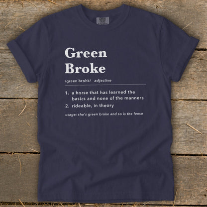 Dark blue t-shirt featuring white text that humorously defines the equestrian term green broke.