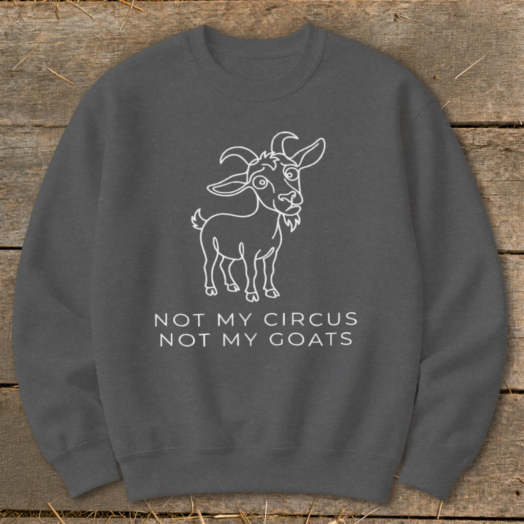 Dark gray sweatshirt with white outline drawing of a goat and text "NOT MY CIRCUS NOT MY GOATS".