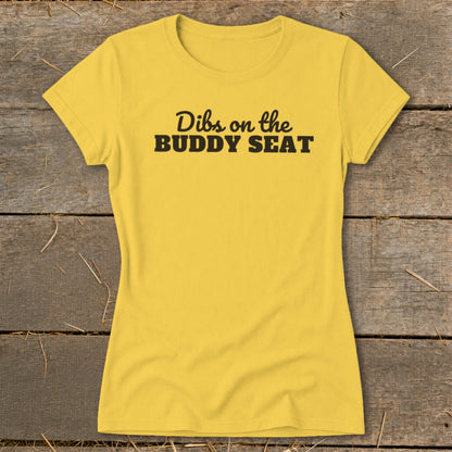 Yellow t-shirt with black text reading "Dibs on the BUDDY SEAT".