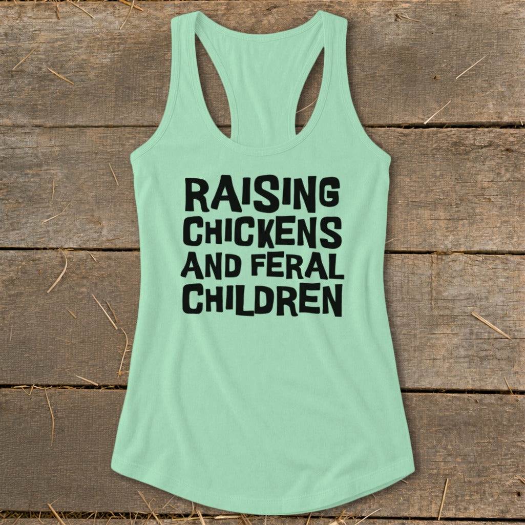 Mint green racerback tank top with black text: "RAISING CHICKENS AND FERAL CHILDREN".