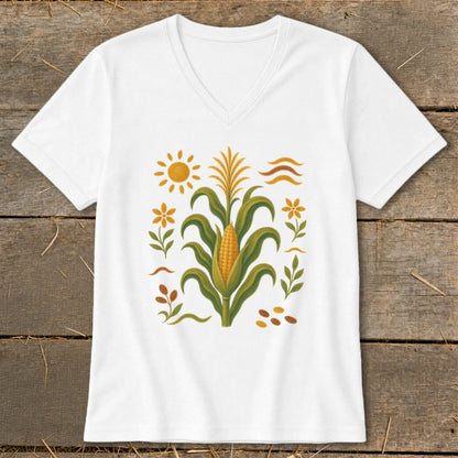 White t-shirt with a stylized corn stalk, sun, and floral elements.