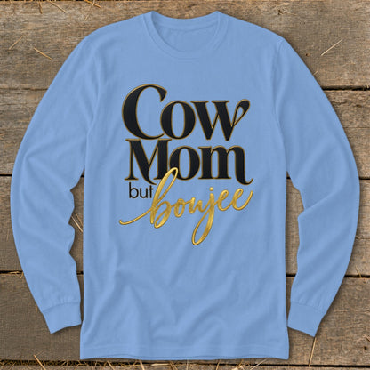 Light blue long-sleeve shirt with "Cow Mom but boujee" in black and gold text.