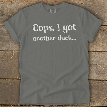 Gray t-shirt with white text "Oops, I got another duck..."
