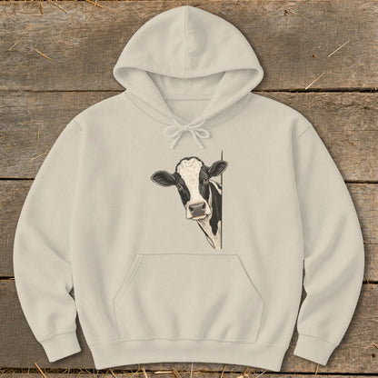 Beige hooded sweatshirt with a peeking black and white cow illustration.