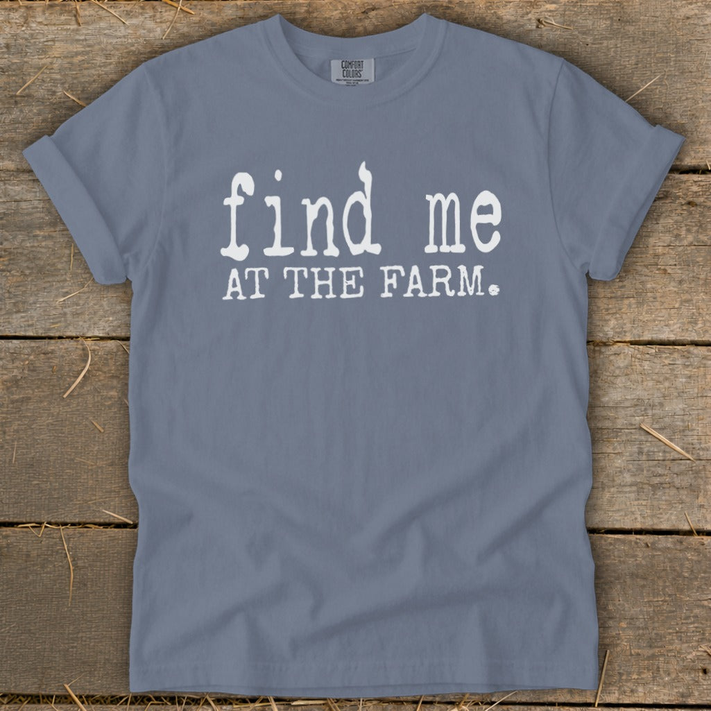 Blue t-shirt with white text "find me AT THE FARM."