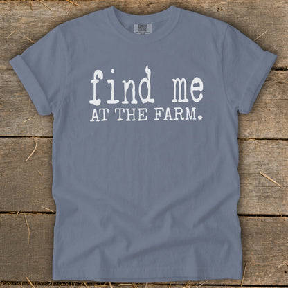 Blue t-shirt with white text "find me AT THE FARM."
