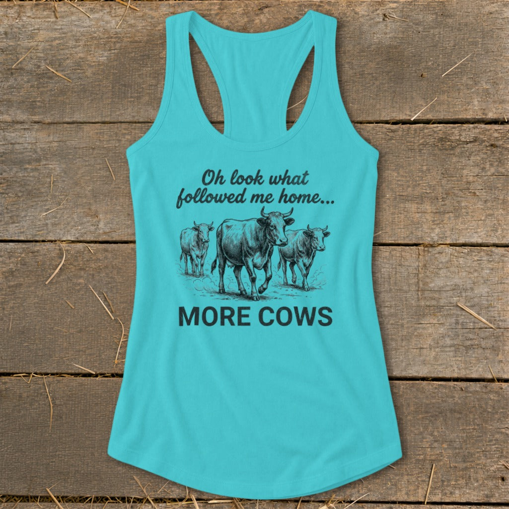 Turquoise tank top with illustration of cows and text "Oh look what followed me home... MORE COWS".