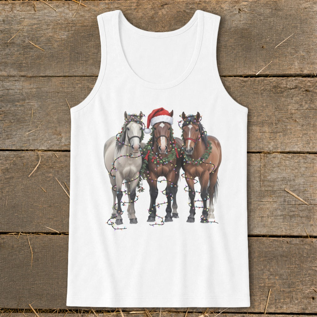 Three horses wear Christmas wreaths and lights, one a Santa hat.