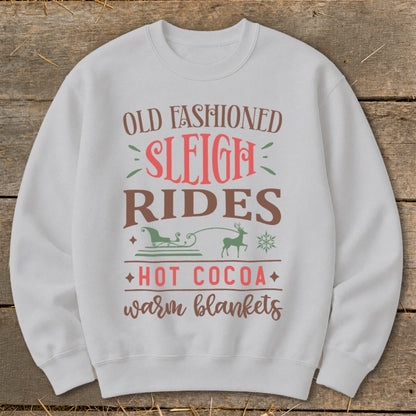 Light gray sweatshirt with "Old Fashioned Sleigh Rides, Hot Cocoa, Warm Blankets" text.