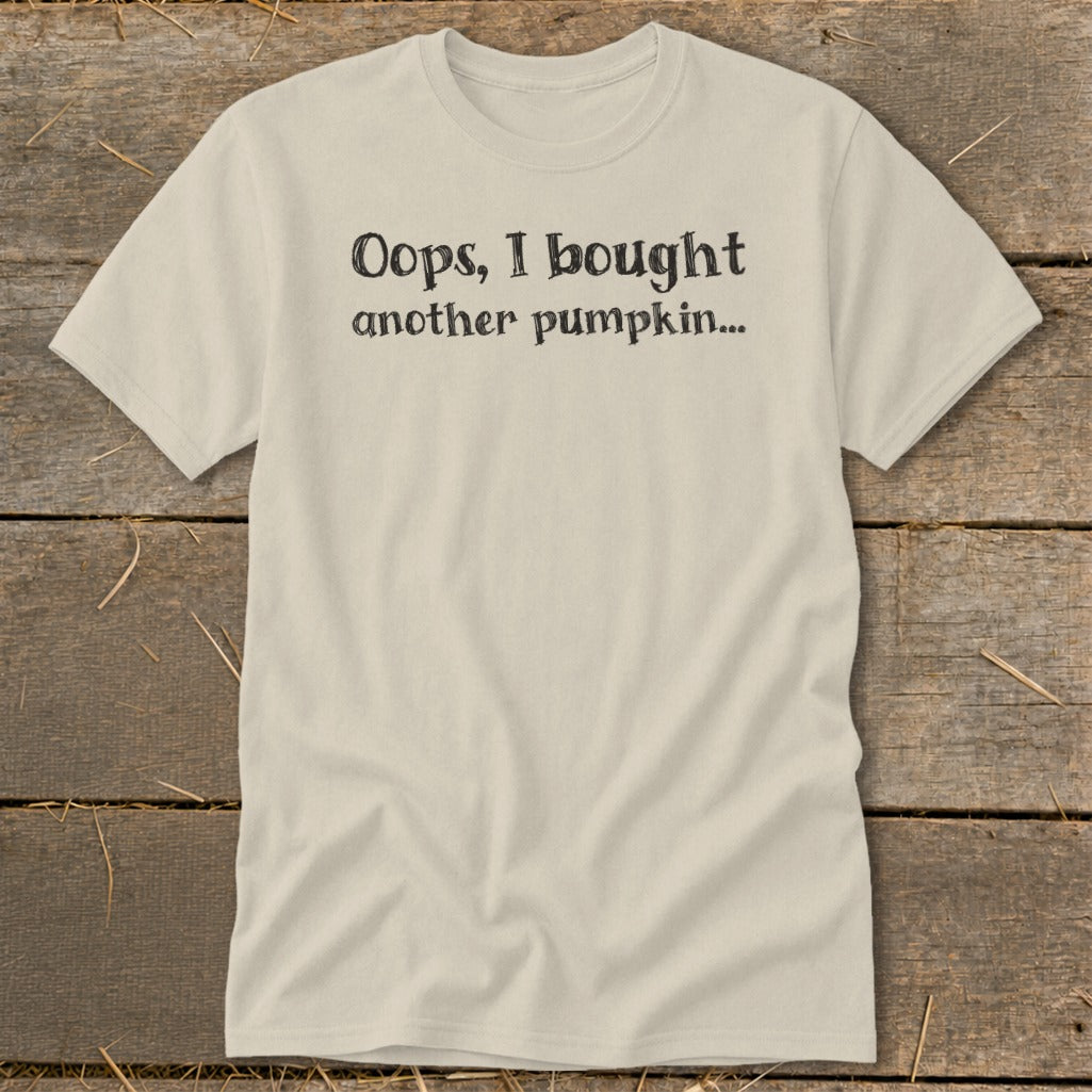 Beige t-shirt with black text "Oops, I bought another pumpkin..."