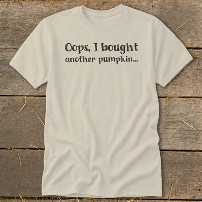 Beige t-shirt with black text "Oops, I bought another pumpkin..."