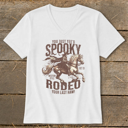 White t-shirt with spooky cowboy on horseback graphic and text.