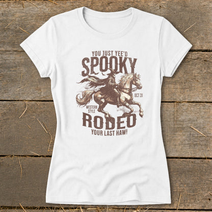 White t-shirt with "Spooky Rodeo" graphic featuring a cowboy on a horse.