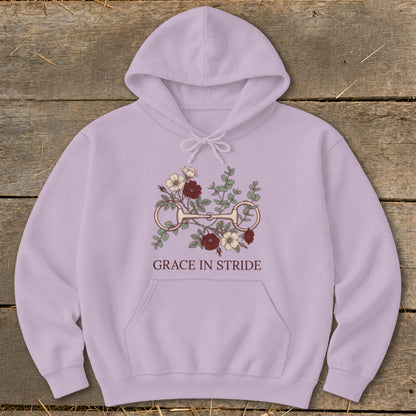 Lavender hoodie with horse bit and floral graphic; text reads "Grace in Stride".