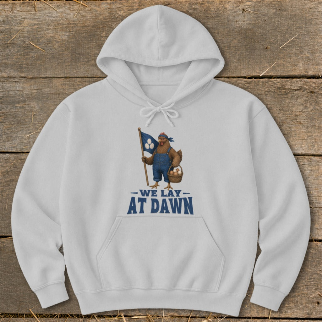 White hoodie with a chicken holding a flag and basket, reads "We Lay At Dawn".