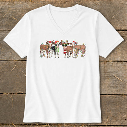 Cartoon cows wearing Santa hats and Christmas lights.