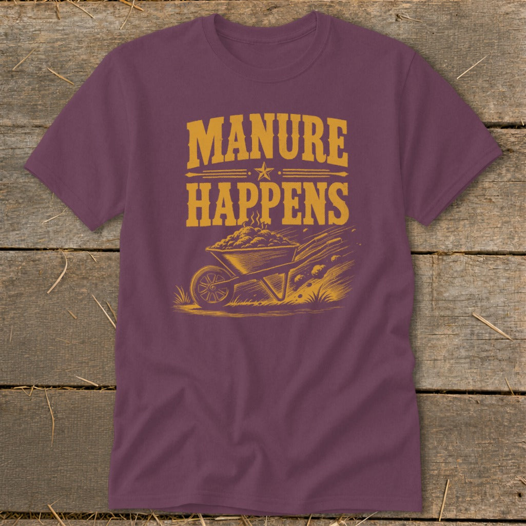 Purple t-shirt with "Manure Happens" text and a wheelbarrow of manure graphic.