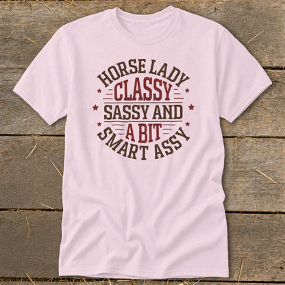Pink t-shirt with "Horse Lady Classy Sassy and a bit smart assy" text design.