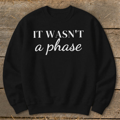 Black sweatshirt with white text "IT WASN'T a phase".