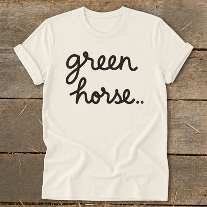 Cream t-shirt with black cursive text "green horse.."