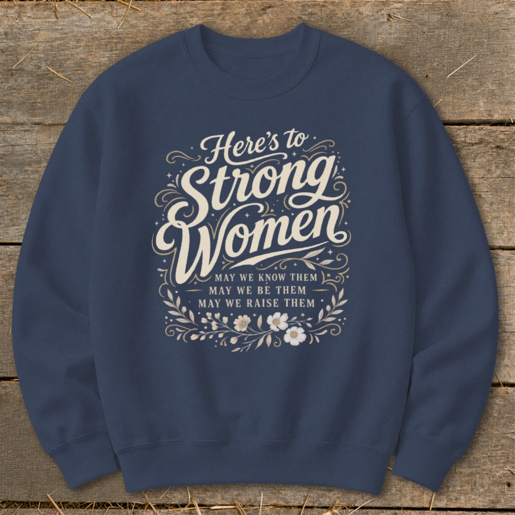 Navy sweatshirt with "Here's to Strong Women" and floral design.