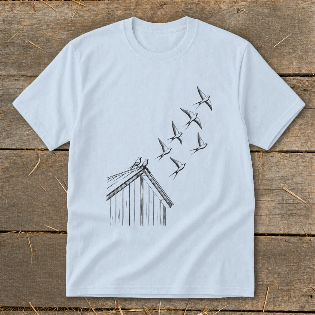 Light blue crewneck t-shirt featuring a black line art graphic of birds taking flight from a rooftop.