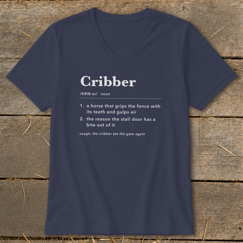 Dark blue V-neck t-shirt featuring a dictionary definition graphic for the word Cribber printed in white.
