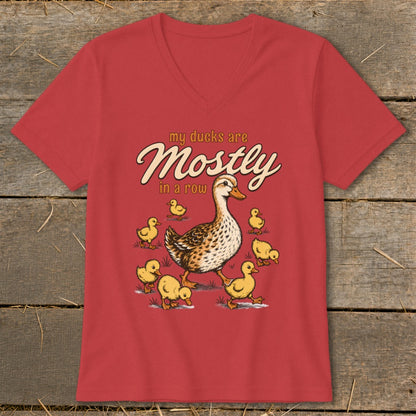 Red t-shirt with illustration of a mother duck and ducklings, text "my ducks are Mostly in a row".