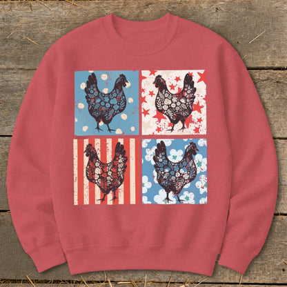 Crewneck sweatshirt with four patterned chickens on a rustic wood background.